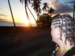 Picture of woman staring into sunset on Maui.