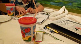 Picture of kids colouring supplies and cool kids cups at the Lahaina Grill, one of the best restaurants in Maui, Hawaii.