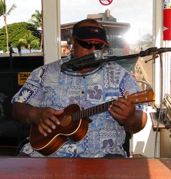 Picture of ukulele playing narrator on the Sugar Cane Train, Maui, Hawaii.