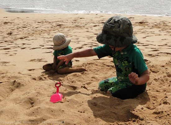 Kids playing on the beach in Maui.