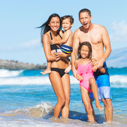 family on the beach in Maui