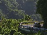 Picture of a car driving the Road to Hana