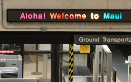 Picture of "Welcome to Maui" sign at Kahului Airport in Hawaii.
