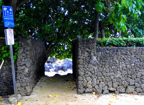 Picture of rock wall entrance to Secret Cove in Makena Maui, Hawaii.