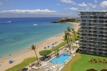 Picture of swimming pool overlooking the Pacific Ocean and the exterior of the Whaler on the island of Maui, Hawaii