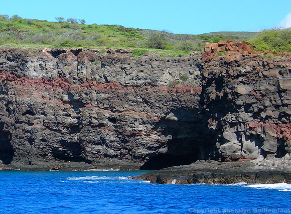 Snorkeling under sea cliffs at the Island of Lanai, Hawaii