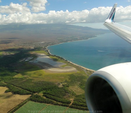 Aerial view of Maui past the plane wing.